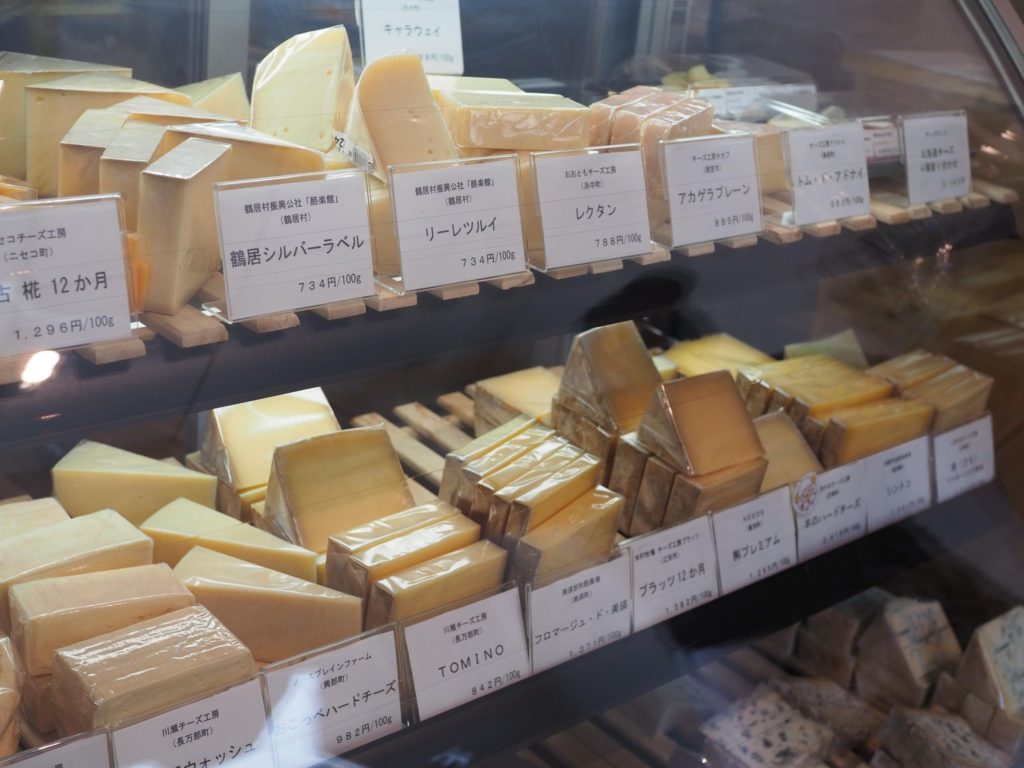Japanese cheeses on display in a Tokyo shop.
