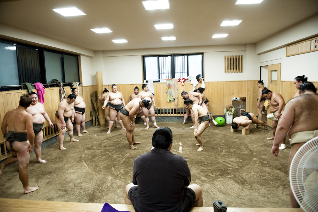 Sumo wrestlers practicing in Asakayama stable.